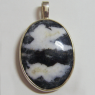 (p1197)Silver pendant with oval colored stone.